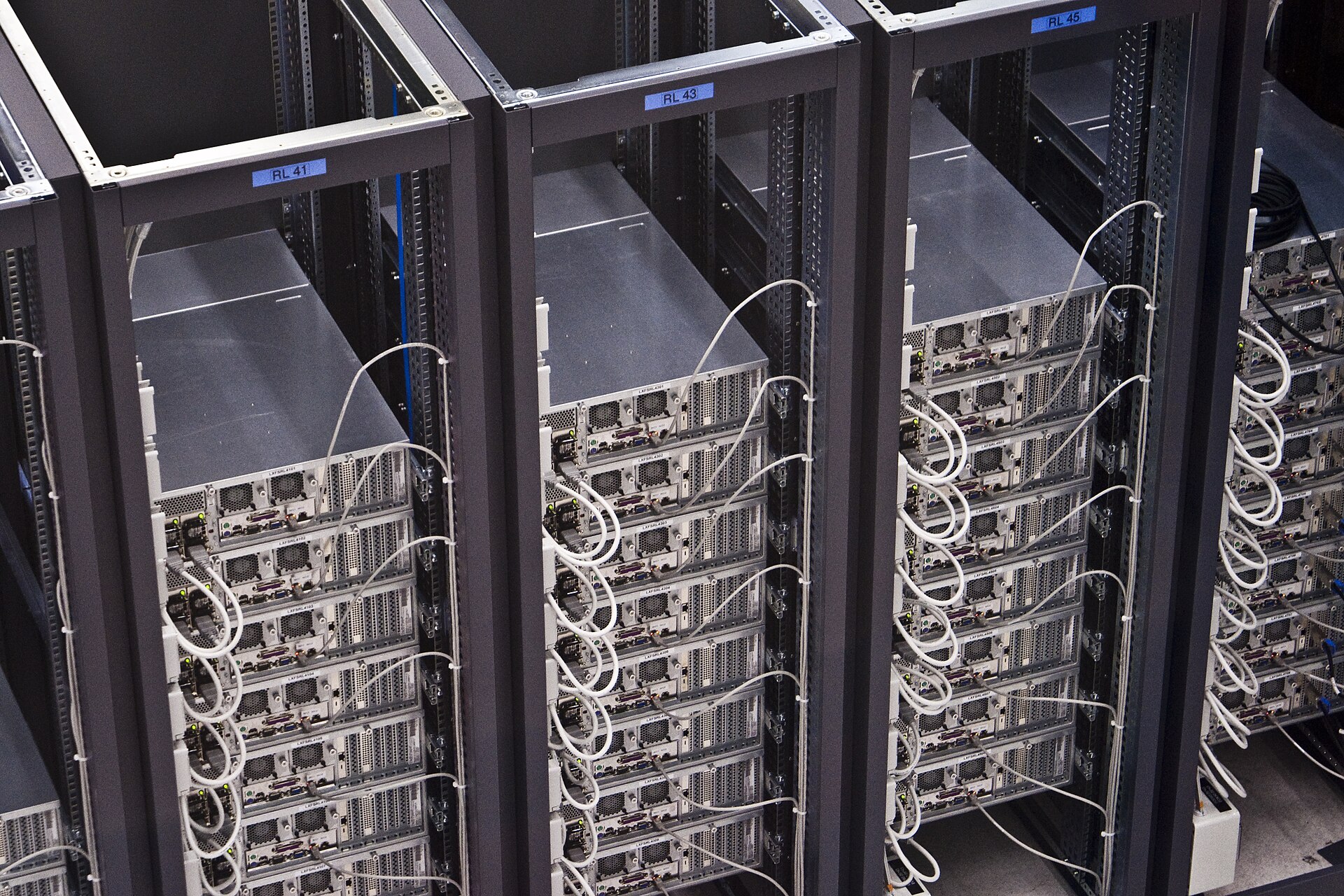 Rows of server racks in a data center hall